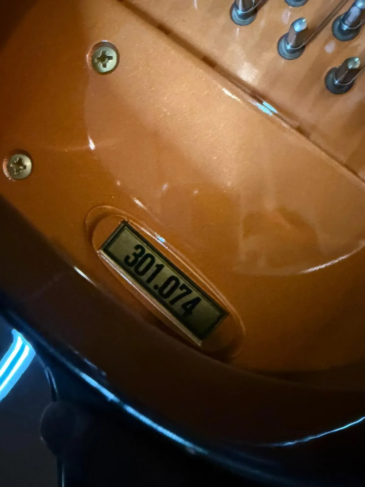A serial number stamped on the plate of a Schimmel grand piano