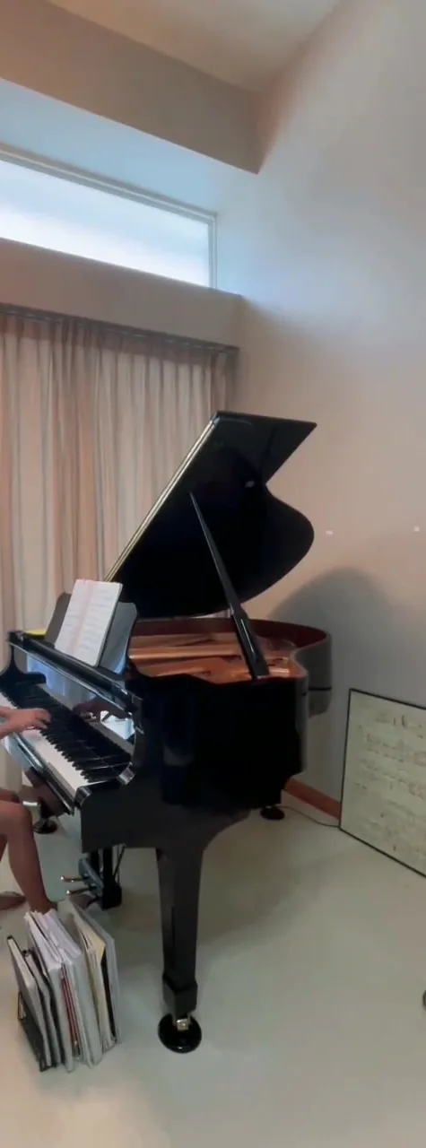A grand piano standing in a home